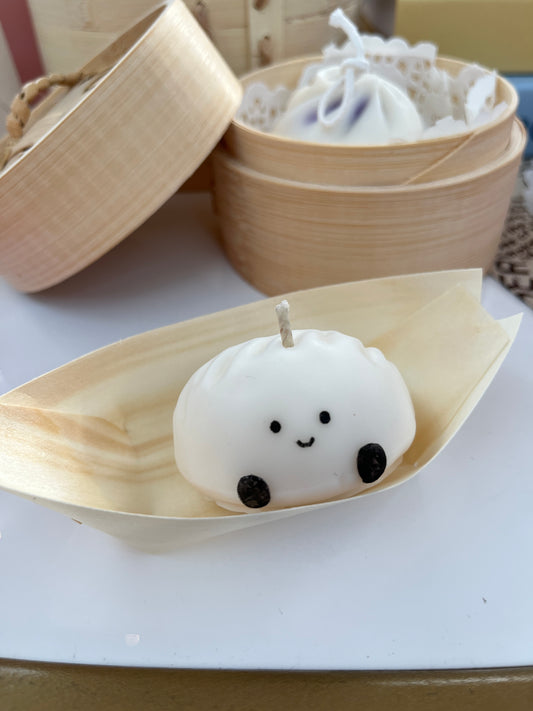 Handmade dumpling-shaped soy wax candle with a face so sweet, you'll hesitate to light her (but do it anyway, he loves the drama)